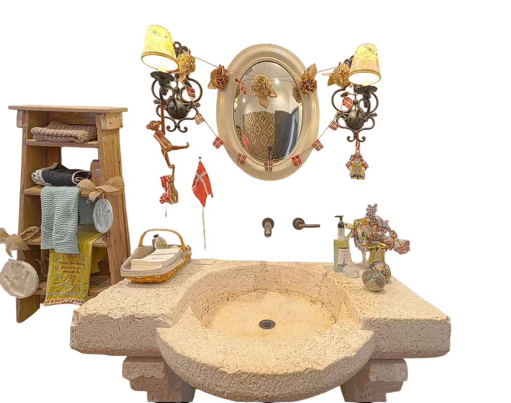 Reclaimed antique limestone vanity sink from Ancient Surfaces cut from one pale block, a wide slab top with a large shallow round basin and a rounded half apron curving forward beneath it, shown installed beneath a mirror and wall sconces